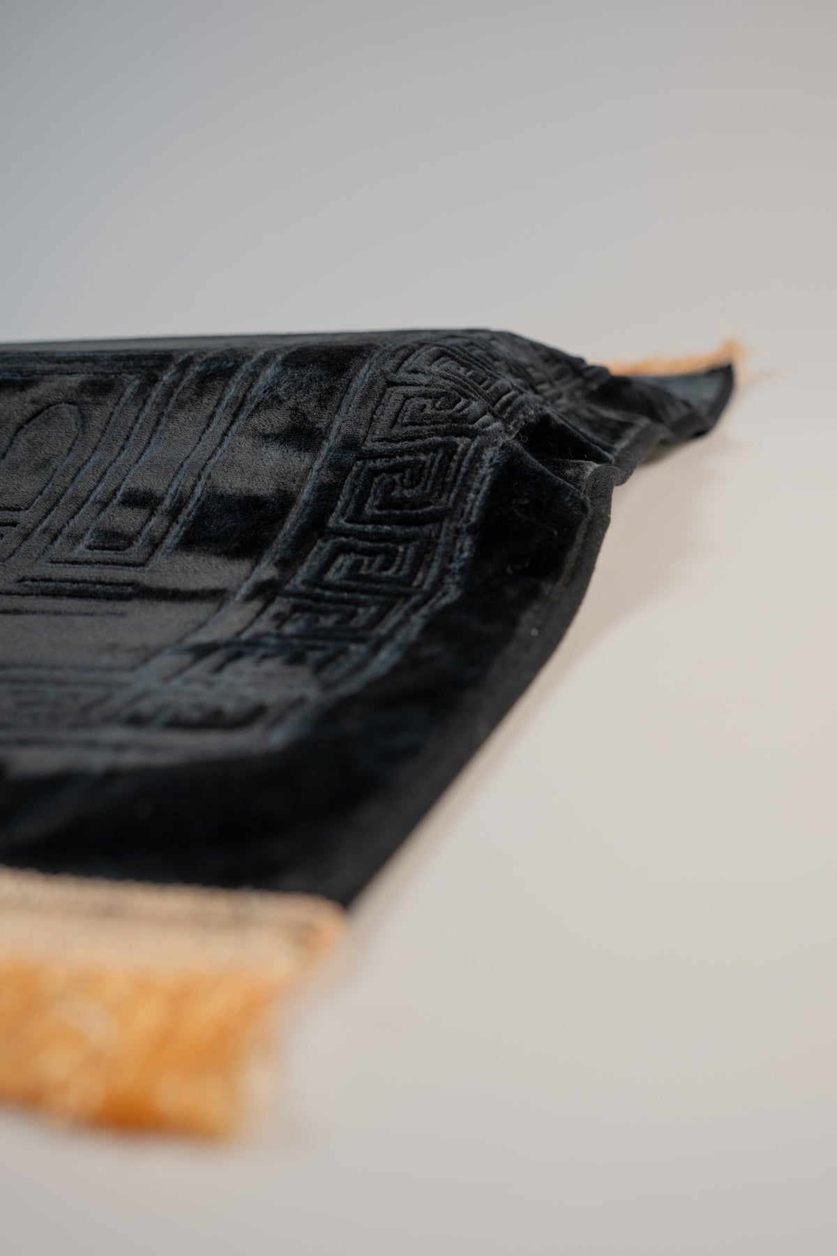 Ergonomic prayer mat in Black, angled view