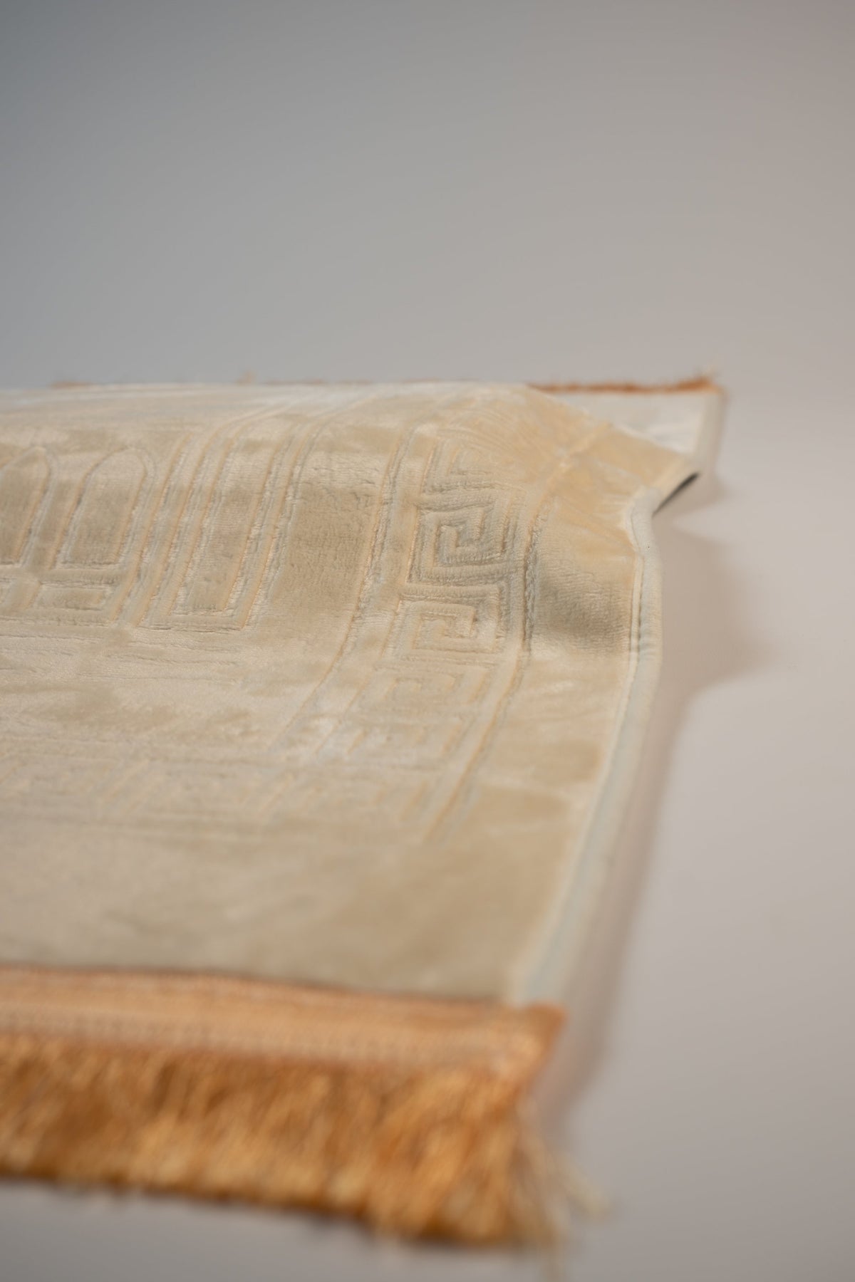Ergonomic prayer mat in Beige, angled view