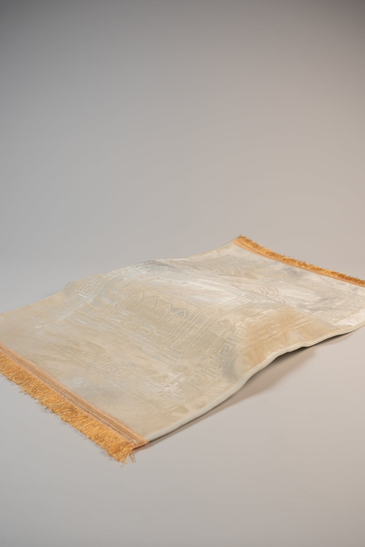 Ergonomic prayer mat in Beige, side view of the padded knee cushion